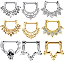 Detailed set of 9 stainless steel septum rings in silver and gold with varied designs