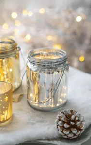 Glow glass candle holder with forest reindeer patterns and a delicate metal handle