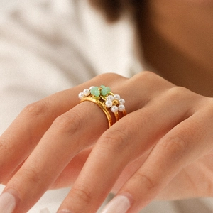 Bohemian gold layered stainless steel ring featuring white pearls and green beaded flowers