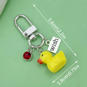 Yellow resin duck keychain with silver metal clip and wish tag, 5.6cm total length