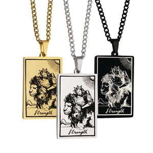 Detailed engraving of Strength tarot cards in gold, silver, and black stainless steel