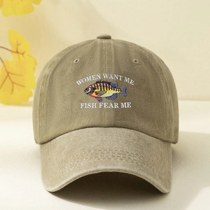 Detailed close-up of khaki washed cotton cap with fish embroidery and slogan text