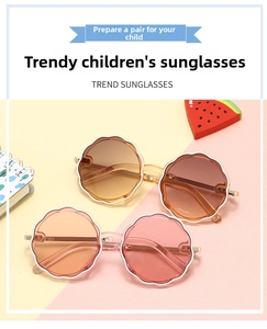 Detail of round flower-shaped kids' sunglasses with metal temples and gradient lenses