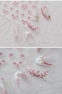 Detailed 5D nail art stickers with pink floral patterns, pearls, and silver bows accessories