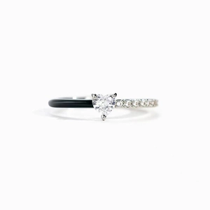 Detail of s925 silver heart ring featuring black enamel and zircon pavé setting
