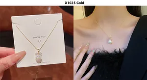 Detailed macro view of a gold bow and pearl necklace with sparkling rhinestones for women