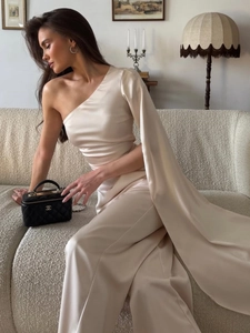 Elegant beige one-shoulder satin dress with a long shawl sleeve and pearl luster finish
