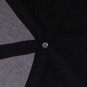 Macro shot of cotton baseball cap interior showing mesh panels and metal rivet detail