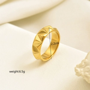 Polished gold geometric ring with 3D pyramid texture and minimalist modern style design