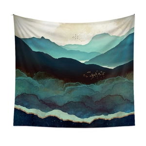 Detail of abstract blue and green mountain tapestry with golden birds on white wall