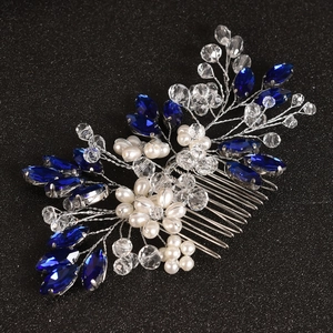 Detail of silver bridal hair comb with blue marquise crystals and white pearls