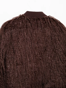 Detail of dark brown faux fur texture and ribbed knit collar on autumn winter jacket