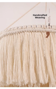 Macro detail of hand-woven cotton lamp shade featuring fine fringe and boho textures