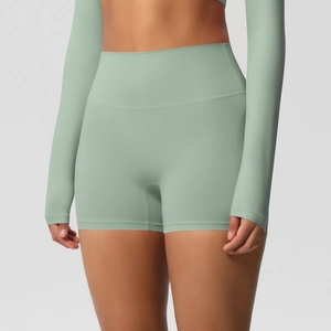 Close-up of sage green high-waisted yoga shorts with wide waistband for tummy control