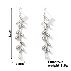 Detail shot of long silver tassel earrings with zircon stones and 5.1cm length measure