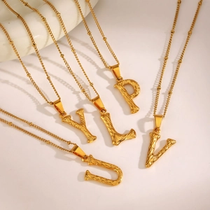 Golden square alphabet pendant necklace with twisted rope chain in minimalist fashion