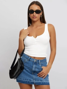 Detailed view of white ribbed knit tank top with U-neck buttons and slim fit texture