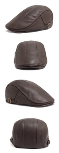 Detail view of brown PU leather flat cap with side buckle and vintage texture