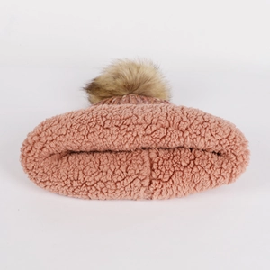 Pink winter knit beanie with soft pompom and warm fleece lining for cold protection