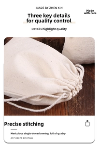 Detailed view of single-needle stitching and drawstring closure on cream canvas pouch