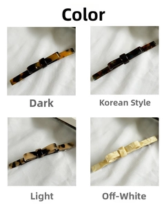 Macro detail of French acetate bow hair clips in tortoise shell and marble patterns