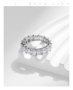 Macro shot of silver S925 eternity ring with square cut sparkling cubic zirconia stones