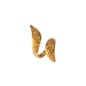 Close-up of gold spiral snake ring featuring detailed floral embossed metal patterns