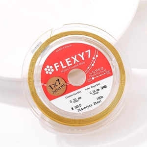Macro shot of Flexy7 0.30mm gold stainless steel 1x7 strand jewelry wire, 100m spool