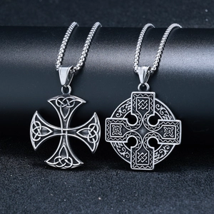 Vintage Celtic knot pendants in silver stainless steel on professional black background