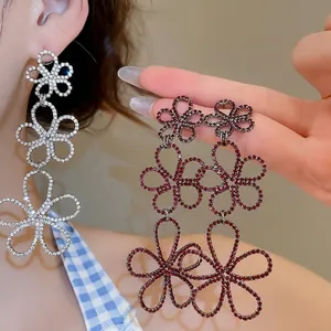 Elegant silver tassel earrings with three-layer hollow flower pattern and crystals
