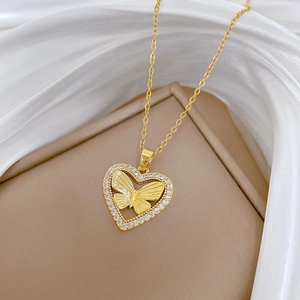 Luxurious gold-tone hollow heart and butterfly necklace with sparkling crystal rhinestones