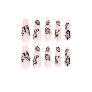 Long ballet press-on nails with nude pink base and black butterfly wing pattern design