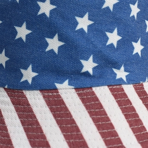 Detail of canvas texture and stitching on sun hat with American flag stars and stripes pattern