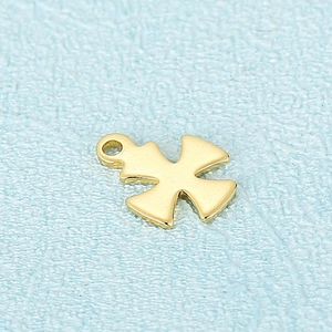 Macro shot of gold hollow cross pendant accessory for DIY jewelry on blue texture