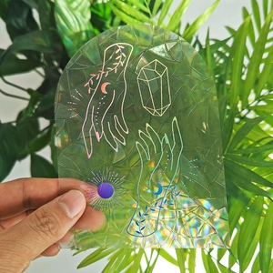 Rainbow suncatcher window sticker with sun and moon line art and holographic glass texture