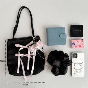 Black satin ballet-style tote bag with pink ribbon bow and dimension labels 19x15.5cm