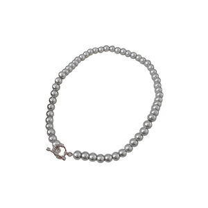 Elegant grey pearl beaded necklace featuring a metallic silver toggle clasp on white background