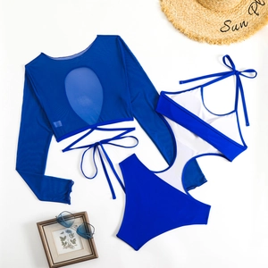 Deep blue long sleeve two-piece swimsuit set with mesh detail and cutout design