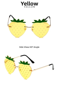 Detail view of strawberry shaped rimless sunglasses with yellow lenses and green leaves