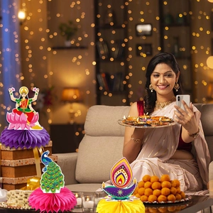Traditional Diwali honeycomb paper centerpieces featuring Goddess Lakshmi and oil diya lamps
