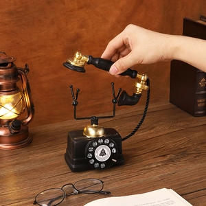Vintage style black and gold rotary phone model ornament for retro desktop decoration