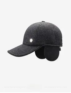 Detail of dark grey winter baseball cap with ear flaps and wool texture for men