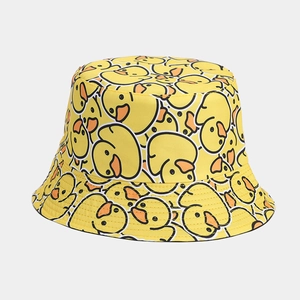 Detail view of cotton bucket hat featuring all-over yellow cartoon duck pattern print