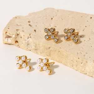 Gold stainless steel stud earrings with glittering zircons and round pearls in cross shape