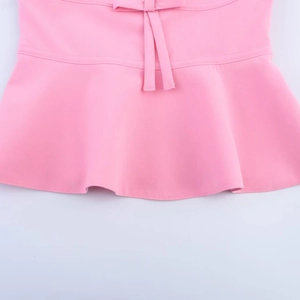 Pink tube top with bow tie and ruffled hem details in a soft knitted fabric