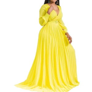 Side view of yellow V-neck maxi dress showing pleated texture and matching waist belt
