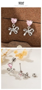 Close-up of pink heart zircon bow earrings with secure screw-back design and silver finish