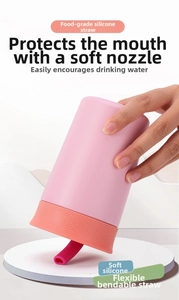 Detail of pink silicone kids straw cup with soft spout and leakproof inverted design