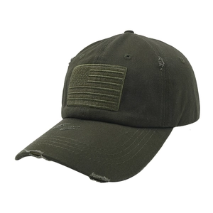 Close-up of distressed olive green baseball cap with monochrome American flag patch