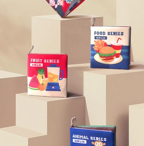 Detailed view of baby soft books featuring fruit, food, and animal cognition themes